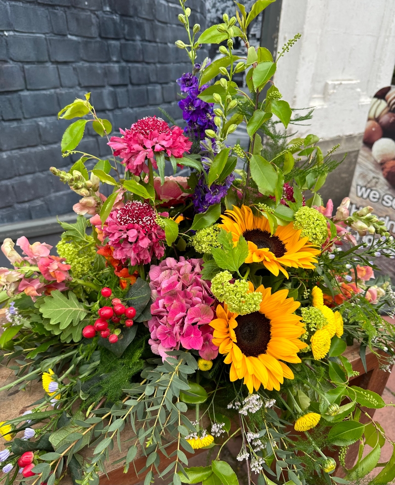 Country garden funeral posy 